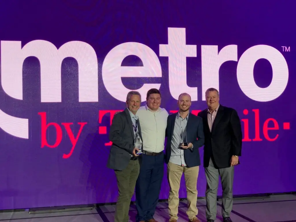 Jimmy Ralph, Travis Ralph, Trevor Ralph, Kevin Killoran (pictured right to left) accepting awards for Talk More Wireless.