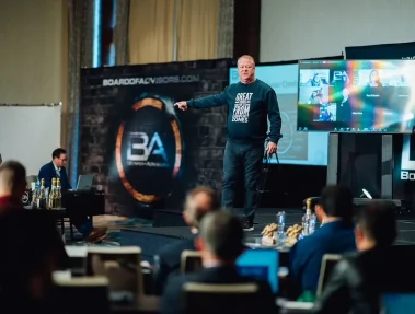 Jimmy Ralph wearing his great things never come from comfort zones sweater while presenting at Board of Advisors.