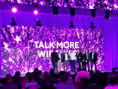 Jimmy Ralph and the Talk More Wireless team accept award at national Metro by T-Mobile ceremony.